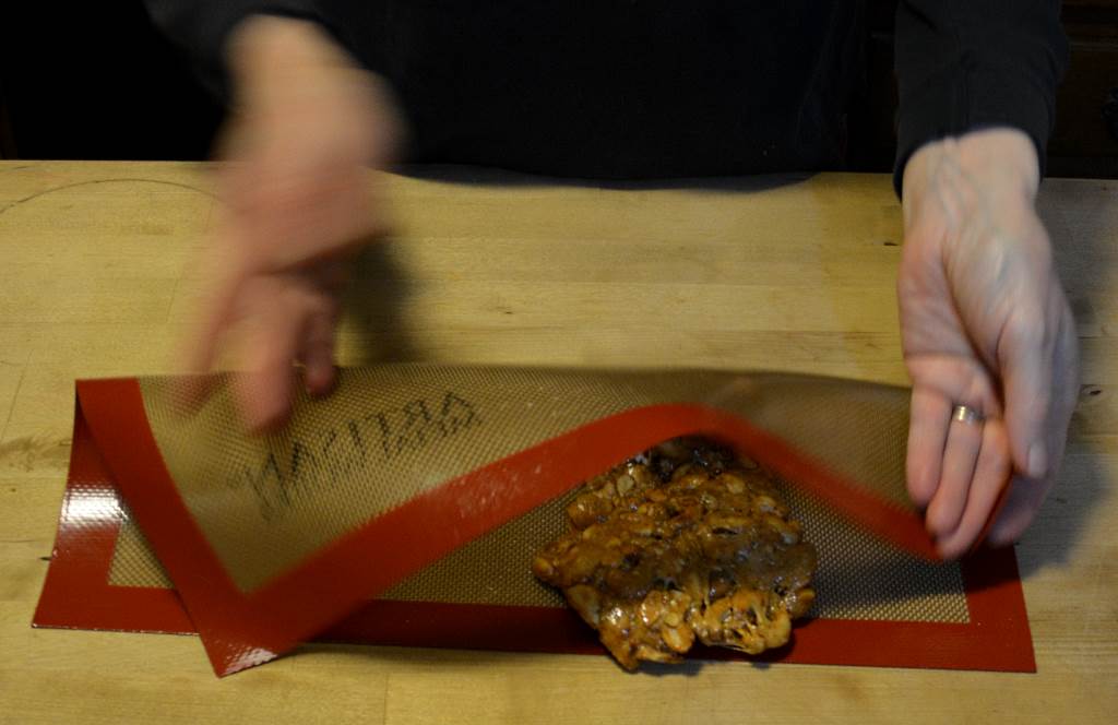 Folding Za'atar Cashew Brittle on silicon baking mat (WEAR GLOVES!)