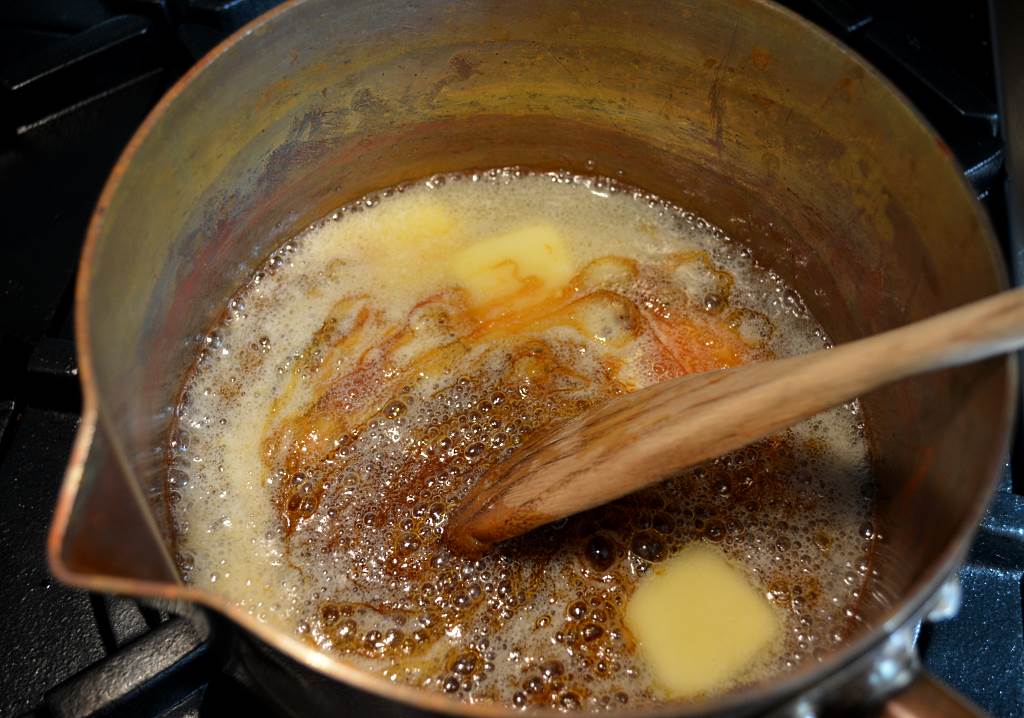 stirring-butter-into-caramelized-sugar