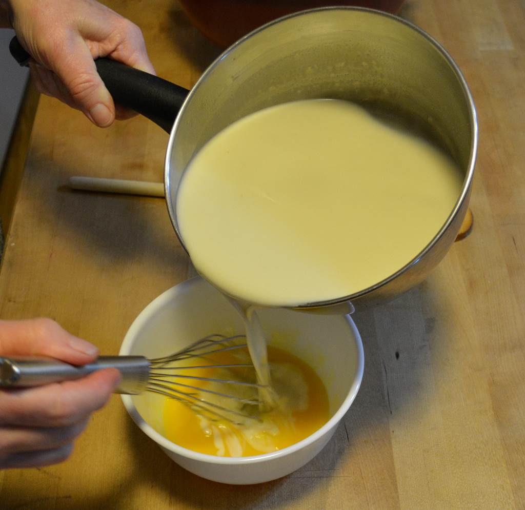 tempering-egg-yolks-with-hot-cream-mixture